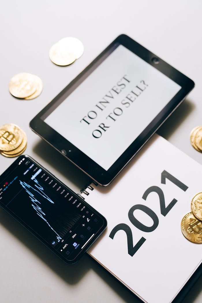Mastering the First Impression: Your intriguing post title goes here Tablet with investment question amidst bitcoins and 2021 planner. Analyze crypto trends.